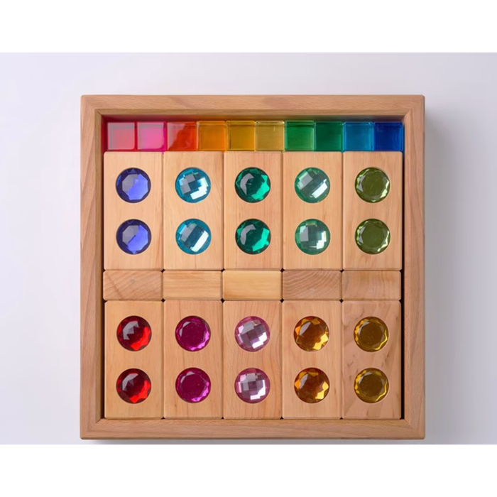 Wooden puzzle with colored gems on a white background