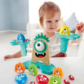 Child playing with a colorful educational toy featuring numbers and shapes