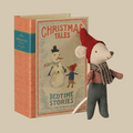 A plush mouse doll dressed in a red hat and scarf, standing next to a vintage-style children's book titled "Christmas Tales: Bedtime Stories" on a plain white background.