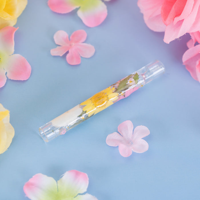 Decorative chillum with pressed flowers on glass