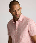 Model is wearing UNTUCKit Coldwell sort sleeve  printed cotton shirt.
